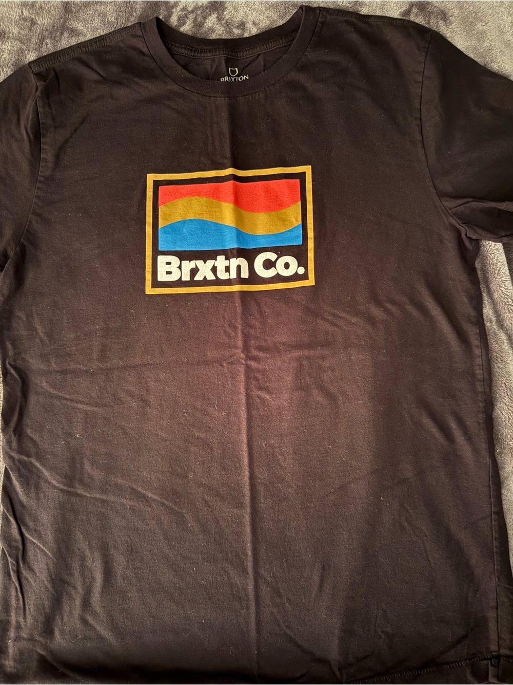 Brixton Black Tee with Red, Yellow and Blue Wave Logo